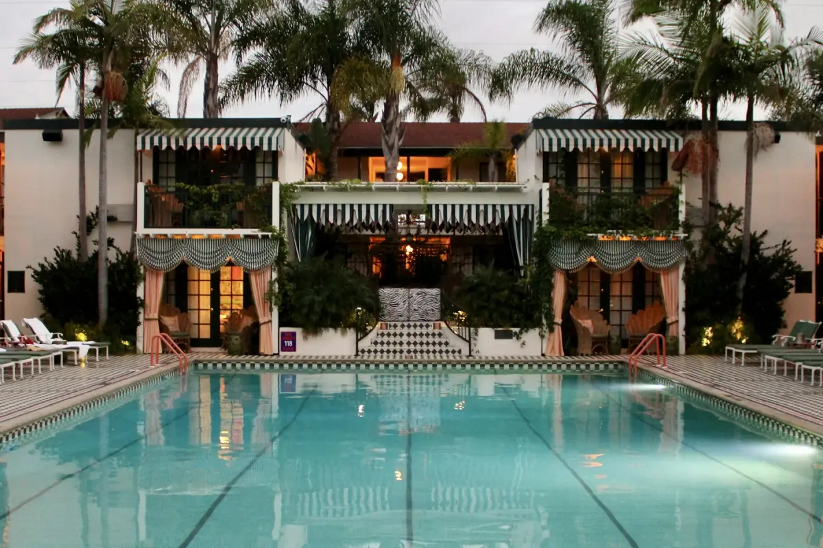 Striped poolside cabanas at dusk